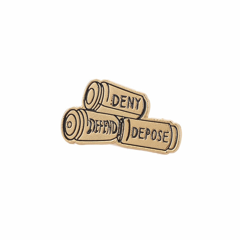 Broche Com Design De Concha Bullet Shell “deny Defend Depose” Em Tom Dourado